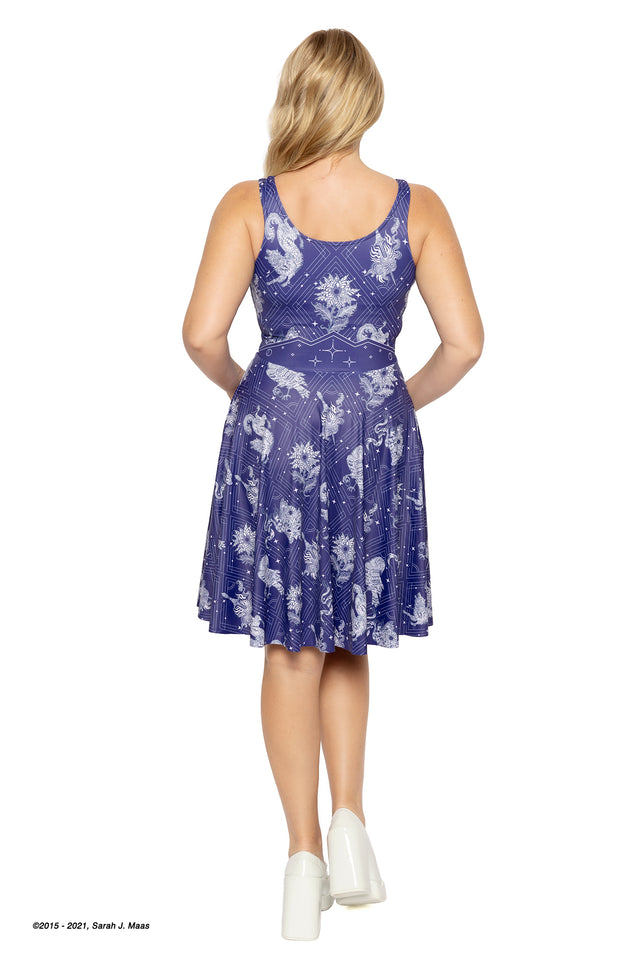A Court of Thorns and Roses Court of Dreams longline dress, ACOTAR inspired scoop dress by Sarah J Maas with moon, stars and creature motifs, midnight tones, relaxed fit and pockets, Night Court aesthetic