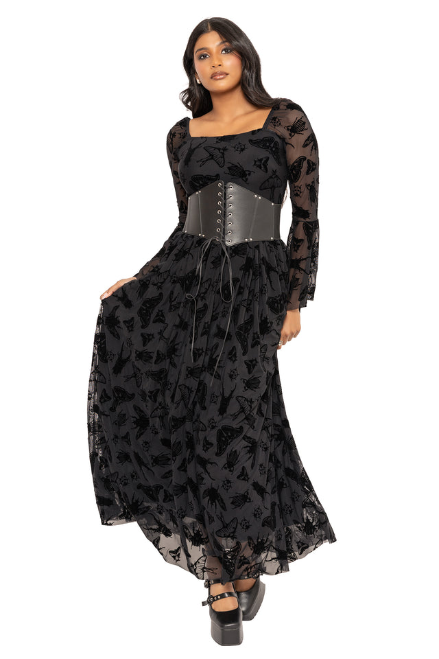 Alternative goth maxi dress with black moth and beetle artwork by Ami Raithe, inspired by cottage witch, dark academia and gothic nature aesthetics. Featuring a flattering square neckline and sheer burned velvet fabric, this fantasy witch dress is perfect for elegant witchcore styling.